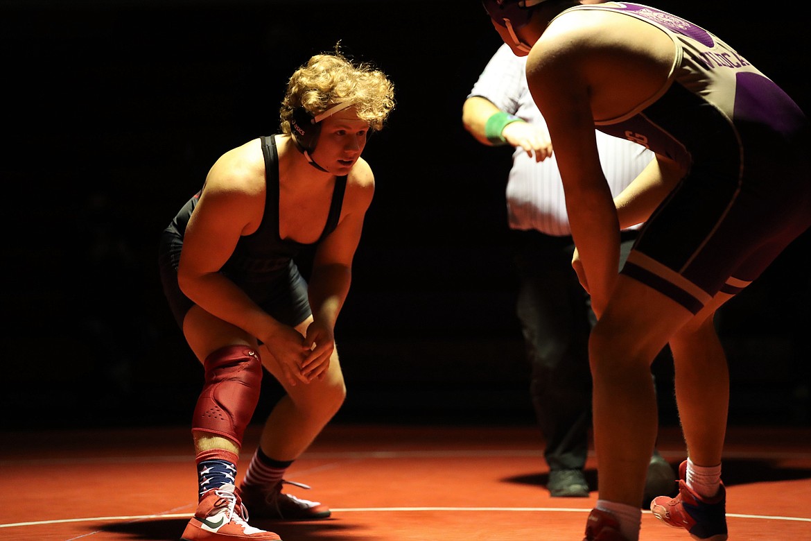 Sandpoint's Blake Sherrill (left) battles Kellogg's Blaine Goodner in a 182-pound bout. Sherrill won the match by pin in 3:01.