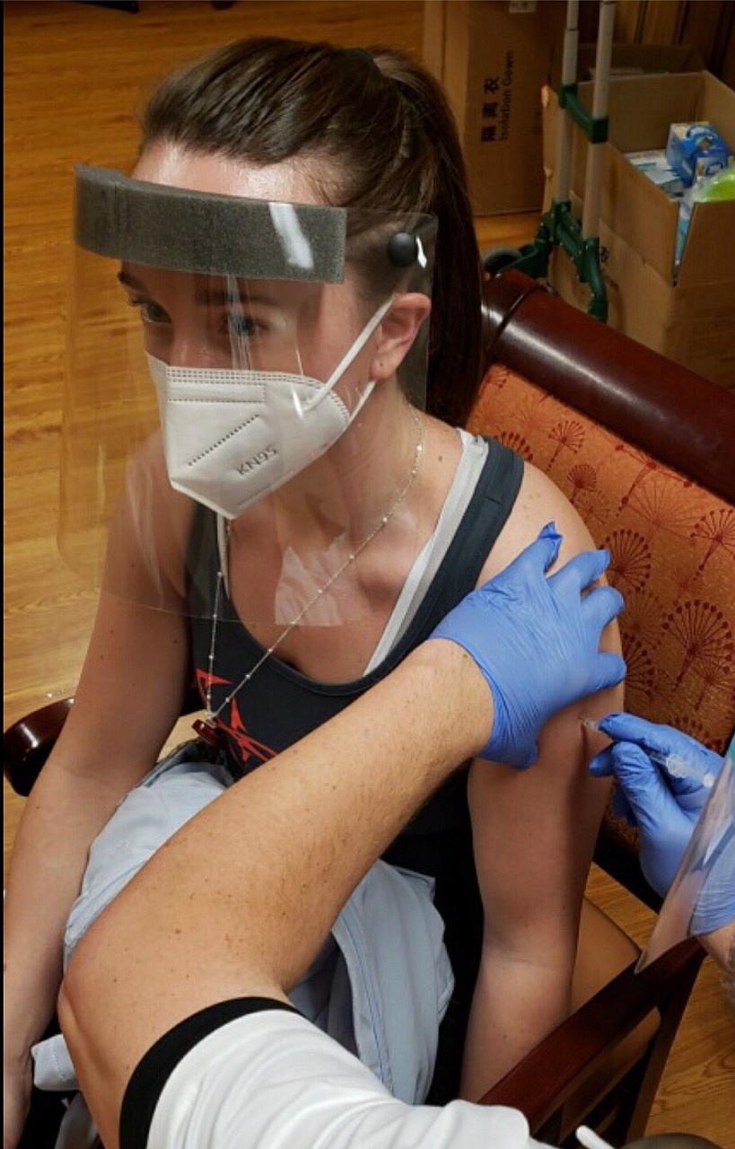 Lake Ridge Center Activities Director Kassandra Kauffman receives her vaccine at the Columbia Crest Center, a Moses Lake nursing home, during a Wednesday vaccination clinic.