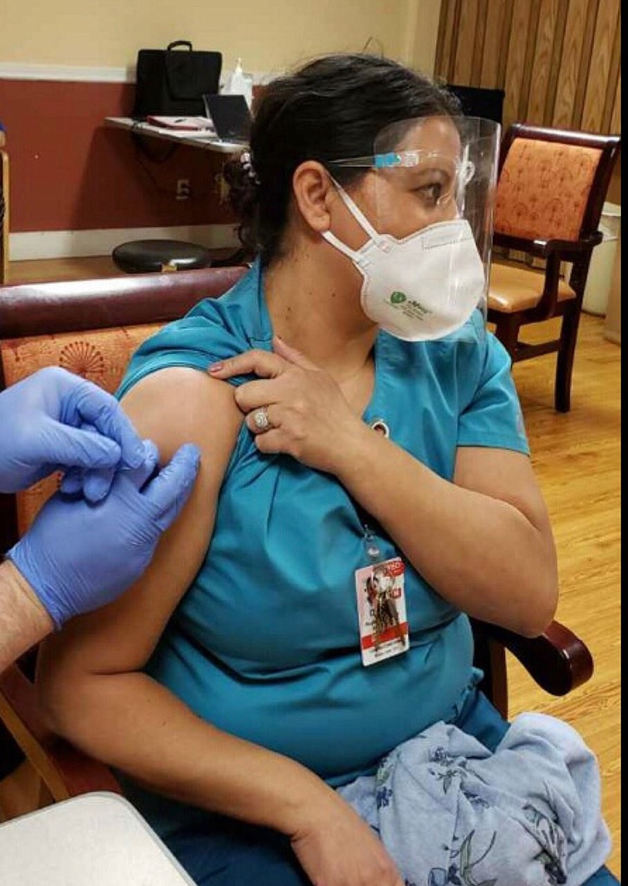 Dora Quintero,Director of Nursing at Columbia Crest Center, a Moses Lake nursing home, receives the coronavirus vaccine at a Wednesday vaccination clinic.