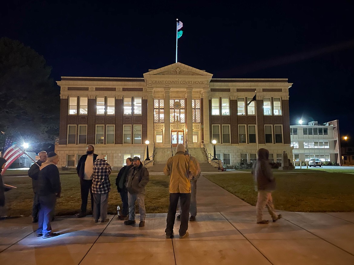 Protesters in front of the Grant County Courthouse in Ephrata.