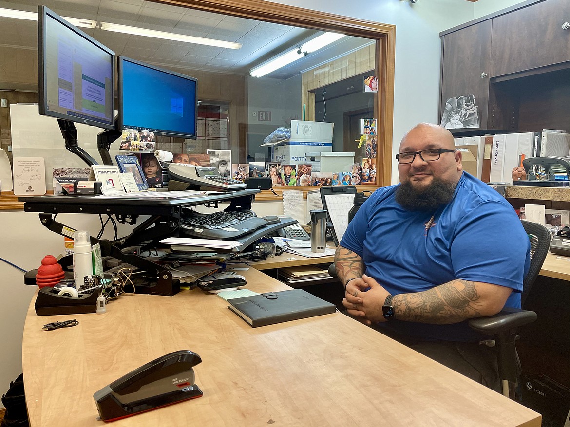 David Garza, operations manager of Flamingo Trucking in Othello, at his command center, where he dispatches and keeps track of Flamingo's trucks and equipment.