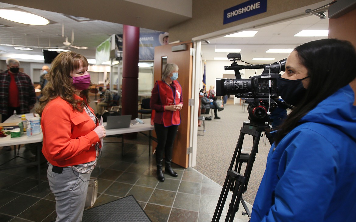 Lead school nurse Nichole Piekarski, left, visits with KXLY reporter Kaitlin Knapp before receiving the first round of the Moderna vaccine Wednesday morning at Panhandle Health District. "I'm really happy, and I'm really hopeful," Piekarski said.