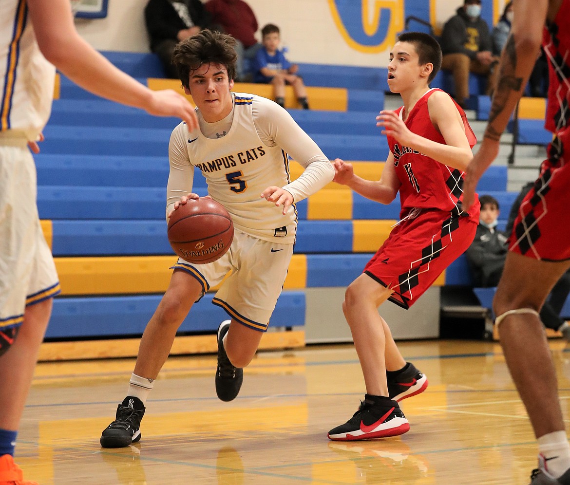 Junior Carter Sanroman bends the corner and drives toward the basket on Thursday.