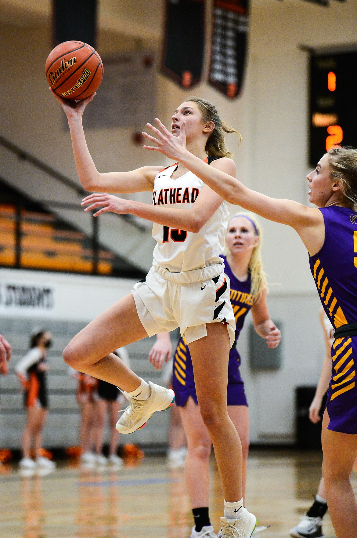 Flathead's Clare Converse (15) drives to the basket in the first half against Missoula Sentinel at Flathead High School on Thursday. (Casey Kreider/Daily Inter Lake)