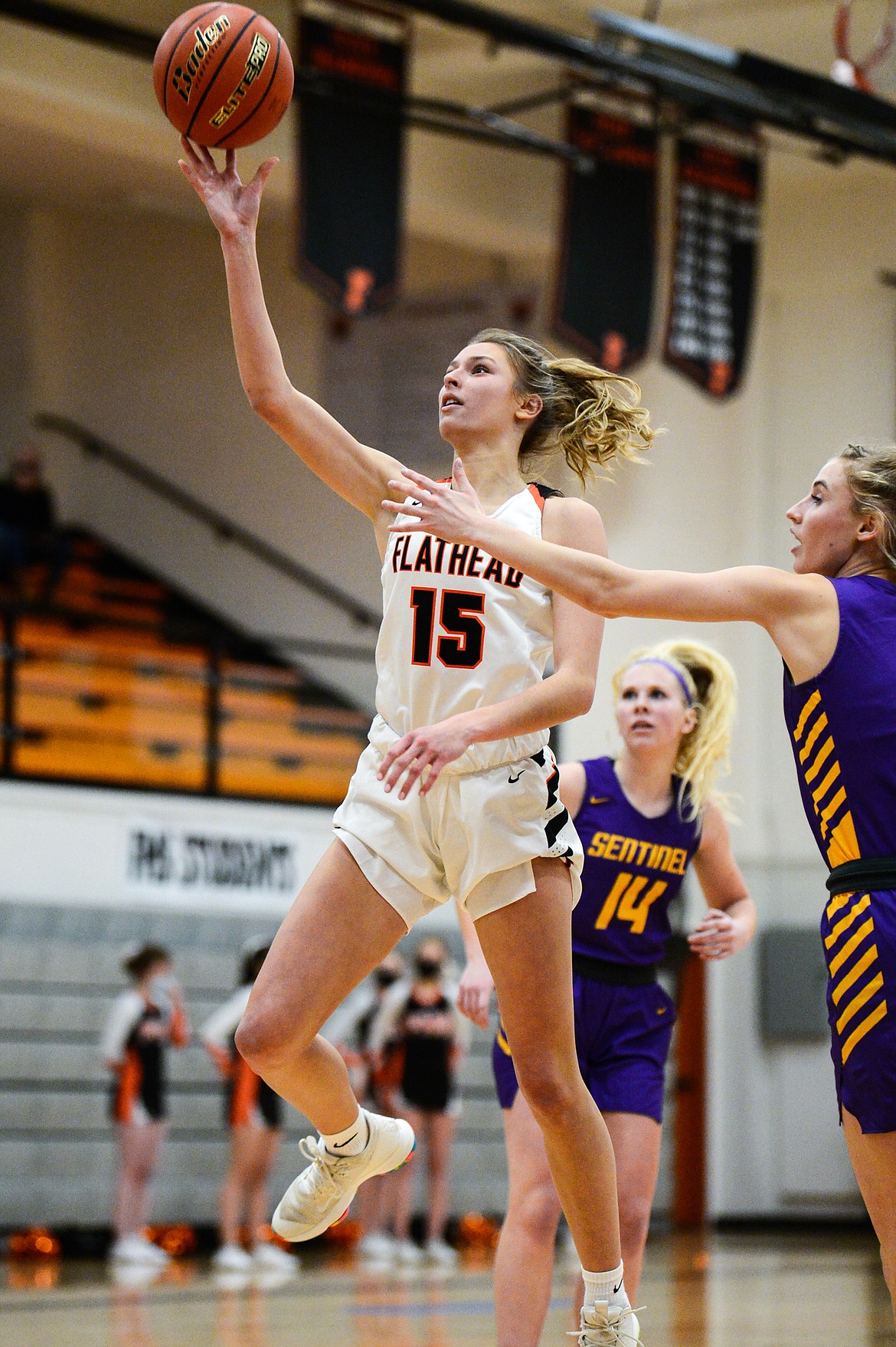 Flathead's Clare Converse (15) drives to the basket in the first half against Missoula Sentinel at Flathead High School on Thursday. (Casey Kreider/Daily Inter Lake)