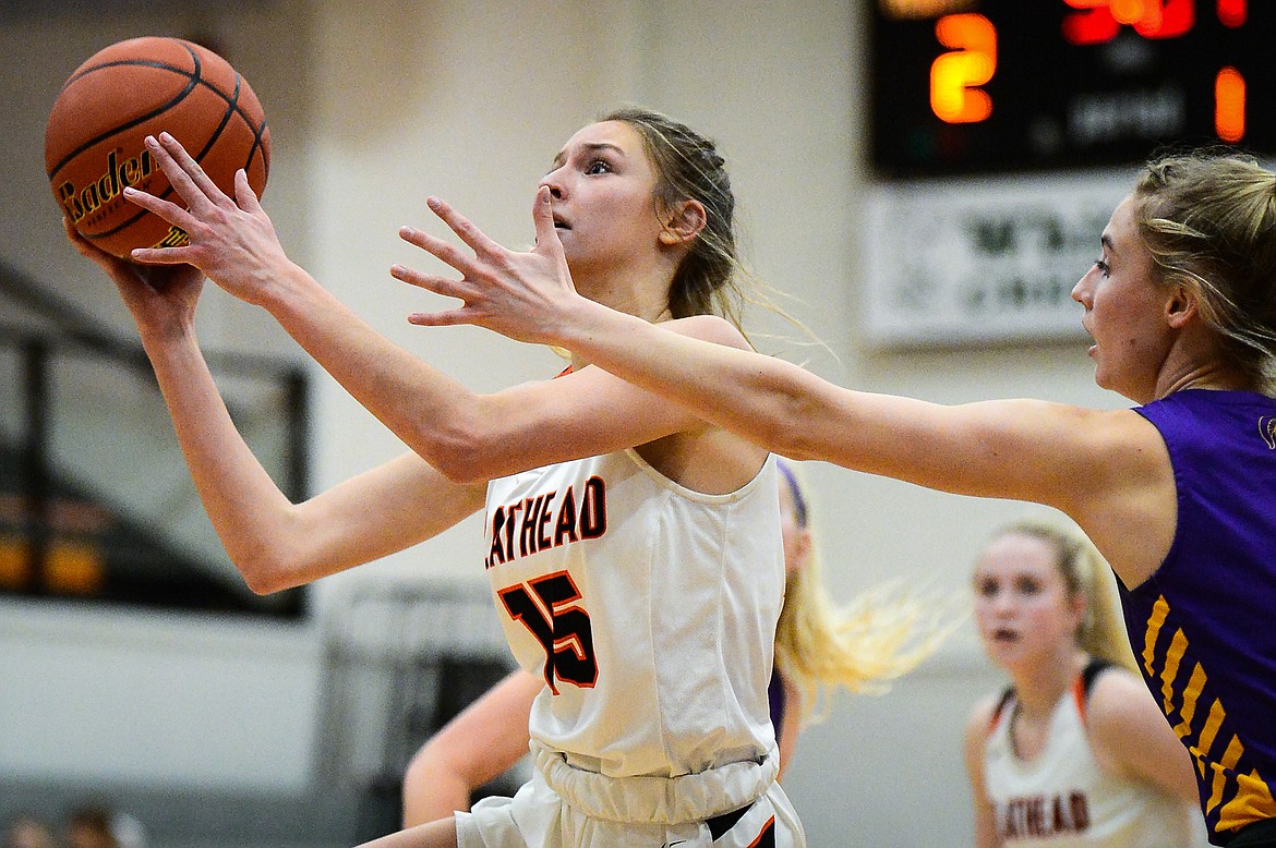 Flathead's Clare Converse (15) drives to the basket in the first half against Missoula Sentinel at Flathead High School on Thursday. (Casey Kreider/Daily Inter Lake)