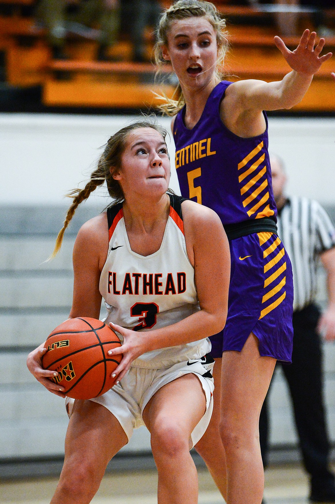 Flathead's Kuyra Seigel (3) goes to the basket against Missoula Sentinel's Brooke Stayner (5) in the first half at Flathead High School on Thursday. (Casey Kreider/Daily Inter Lake)