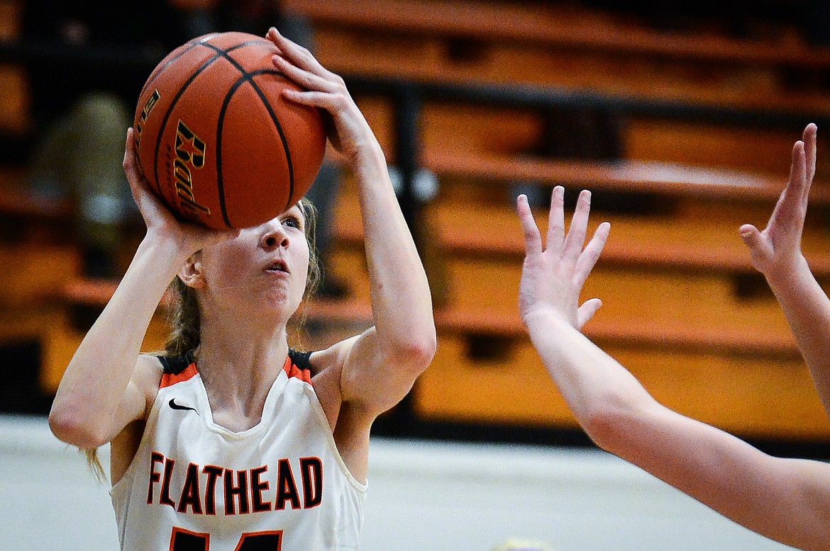 Flathead's Kennedy Moore (14) looks to shoot in the first half against Missoula Sentinel at Flathead High School on Thursday. (Casey Kreider/Daily Inter Lake)