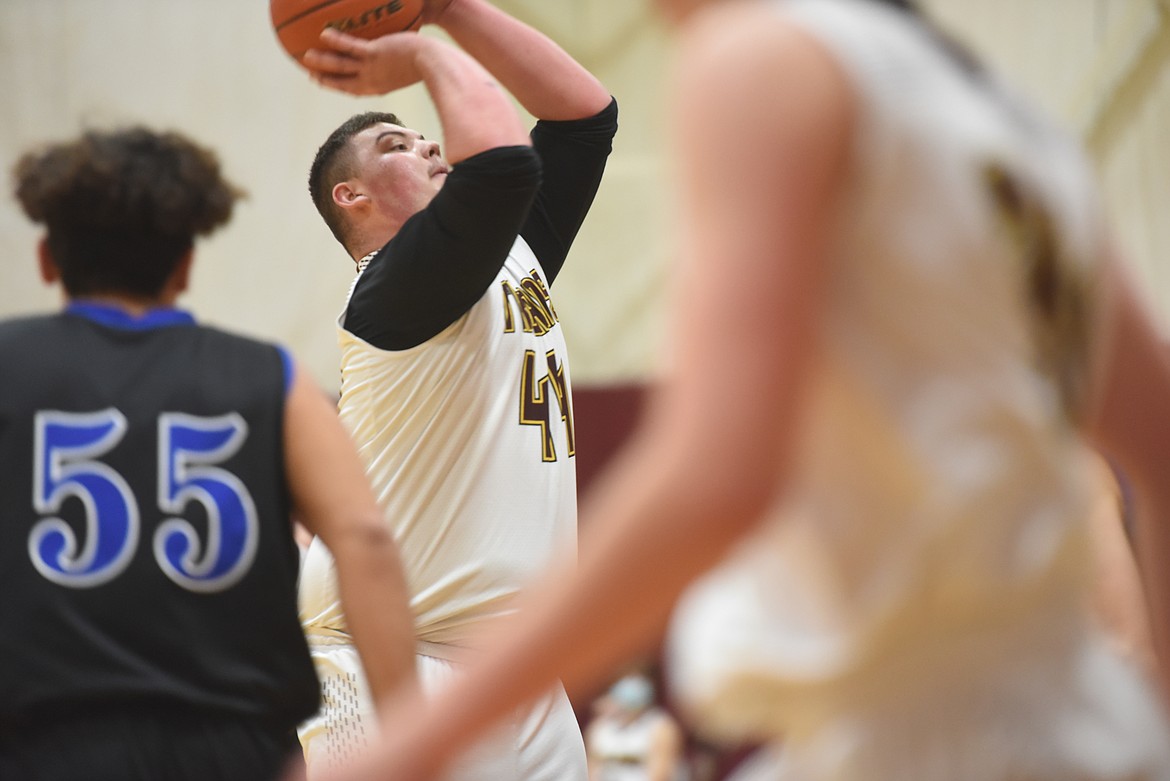 Senior Jace Fisher takes a shot during Troy's Jan. 5 game against Stillwater. (Will Langhorne/The Western News)