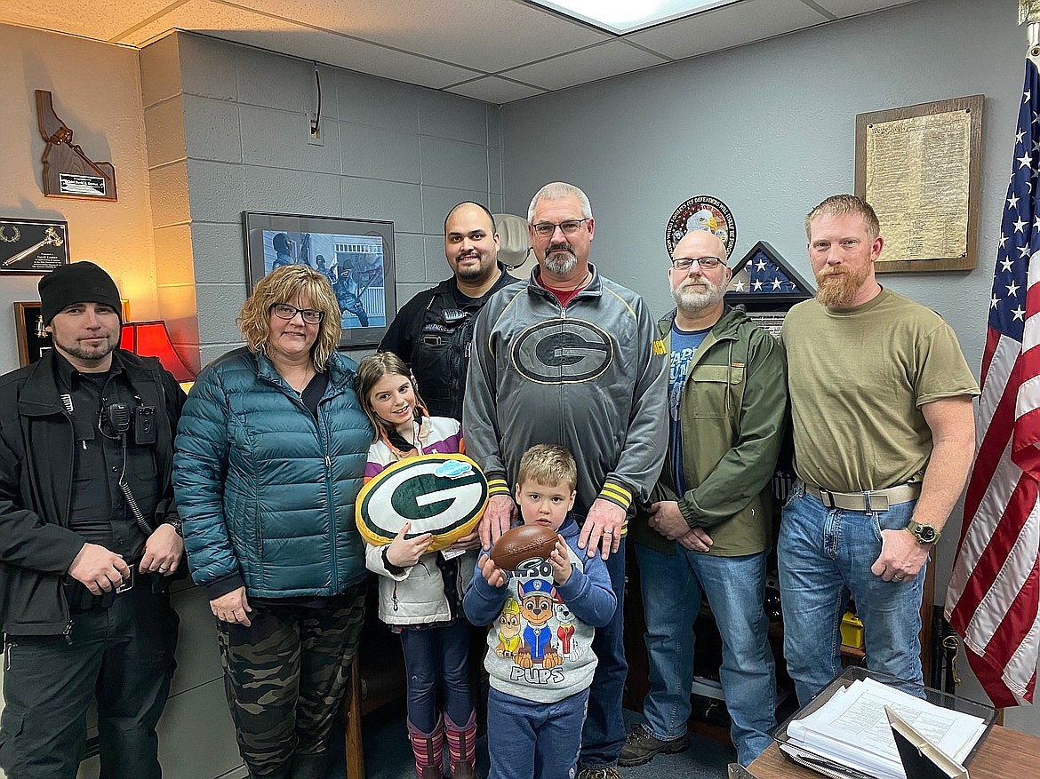 Sheriff’s Deputy Brandon Blackmore, Cheryl Navarro, Torrie (in front of her grandmother), Sheriffs Cpl. Mike Valenzuela, Bryan Navarro, Hudsyn (in front of his grandfather), Sheriff’s Cpl. Clint Randall and Sheriff’s Detective Caleb Watts.