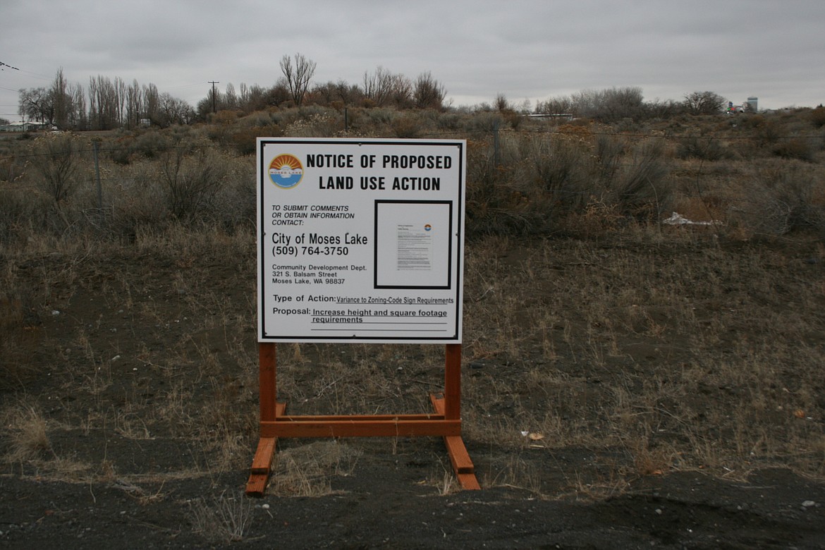 A sign announces a previous public hearing for the Love's Travel Stop project on Idaho Road in Moses Lake.