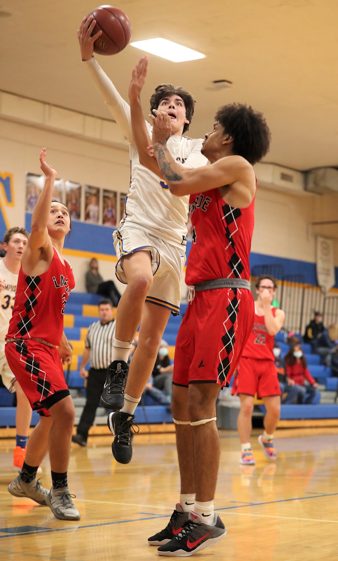 Carter Sanroman elevates for a layup over the Lakeside defense on Thursday.