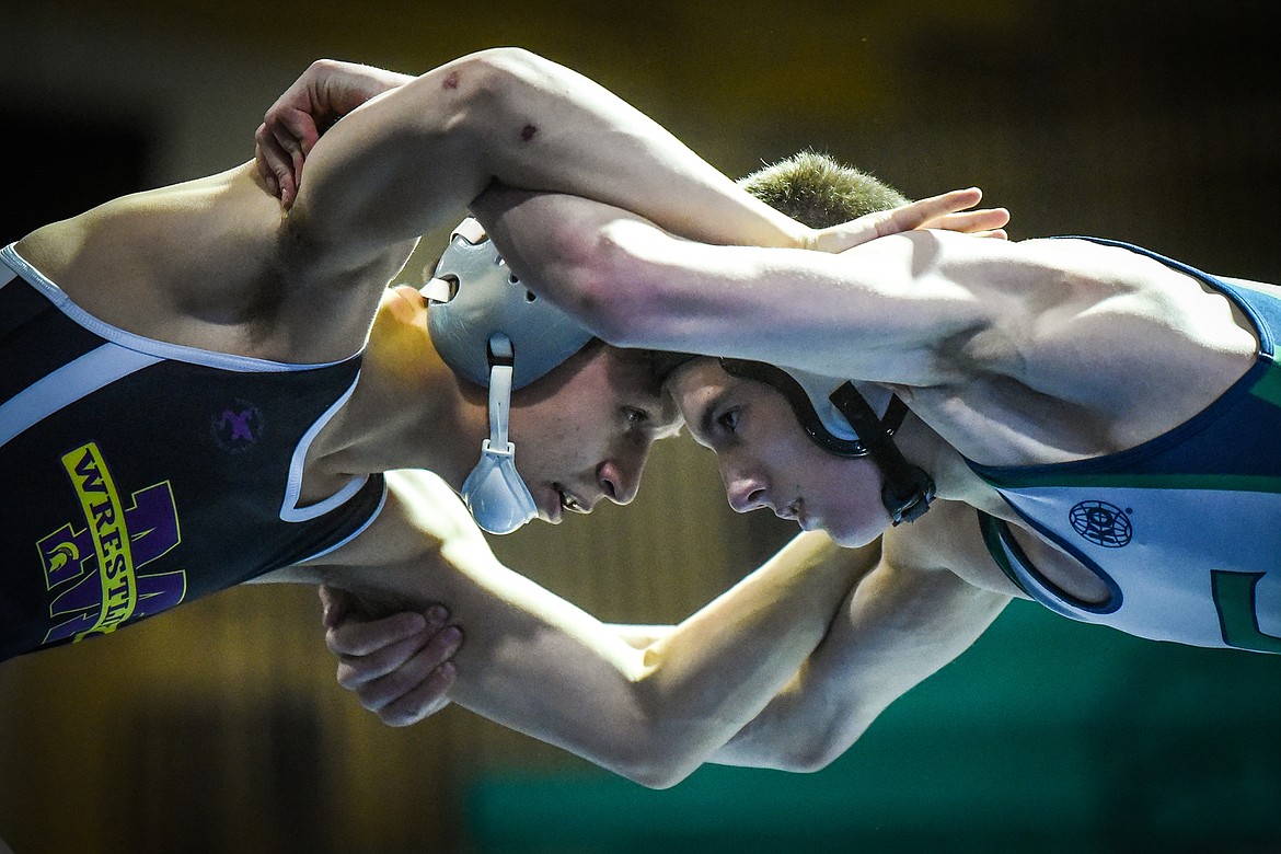 Glacier's Seth Doolan and Missoula Sentinel's Novik Thomas lock up at 132 lbs. at Glacier High School on Friday. (Casey Kreider/Daily Inter Lake)