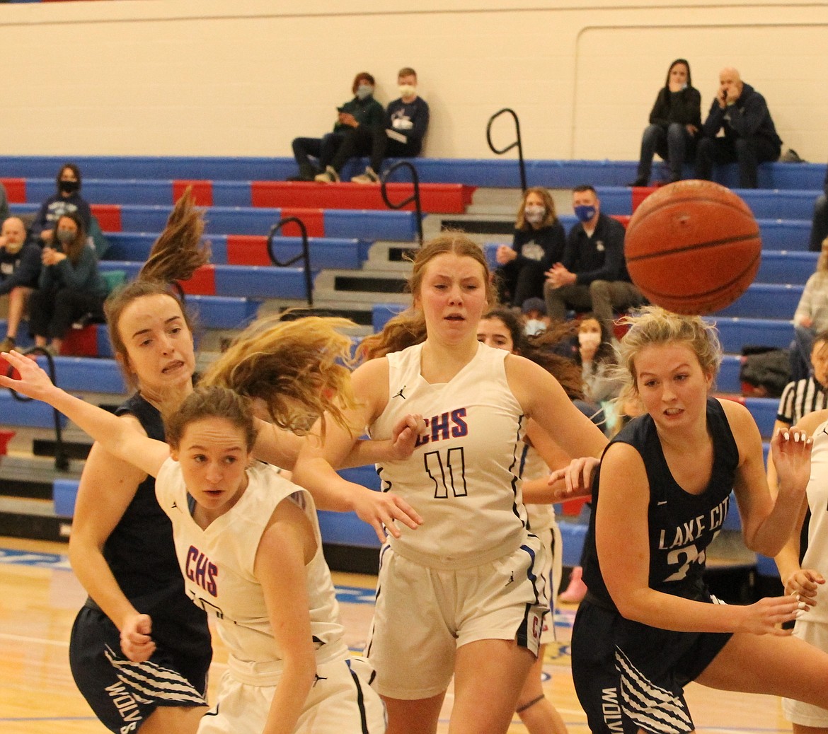 JASON ELLIOTT/Press
Coeur d'Alene's Emma Whiteman (10) and Madi Symons (11) attempt to chase down a loose ball from Lake City's Brenna Hawkins (24) during the second half of Friday's game at Viking Court.