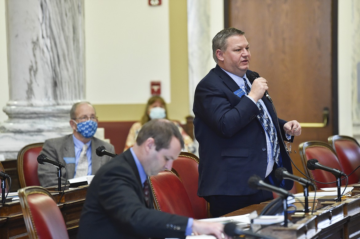 FILE - In this Dec. 7, 2020, file photo, Sen. Jason Ellsworth, R-Hamilton, speaks during a meeting of the Joint Rules Committee on the House floor of the Montana State Capitol, in Helena, Mont. As states brace for a coronavirus surge following holiday gatherings, one place stands out as a potential super-spreader site, the statehouses where lawmakers will help shape the response to the pandemic. (Thom Bridge/Independent Record via AP, File)