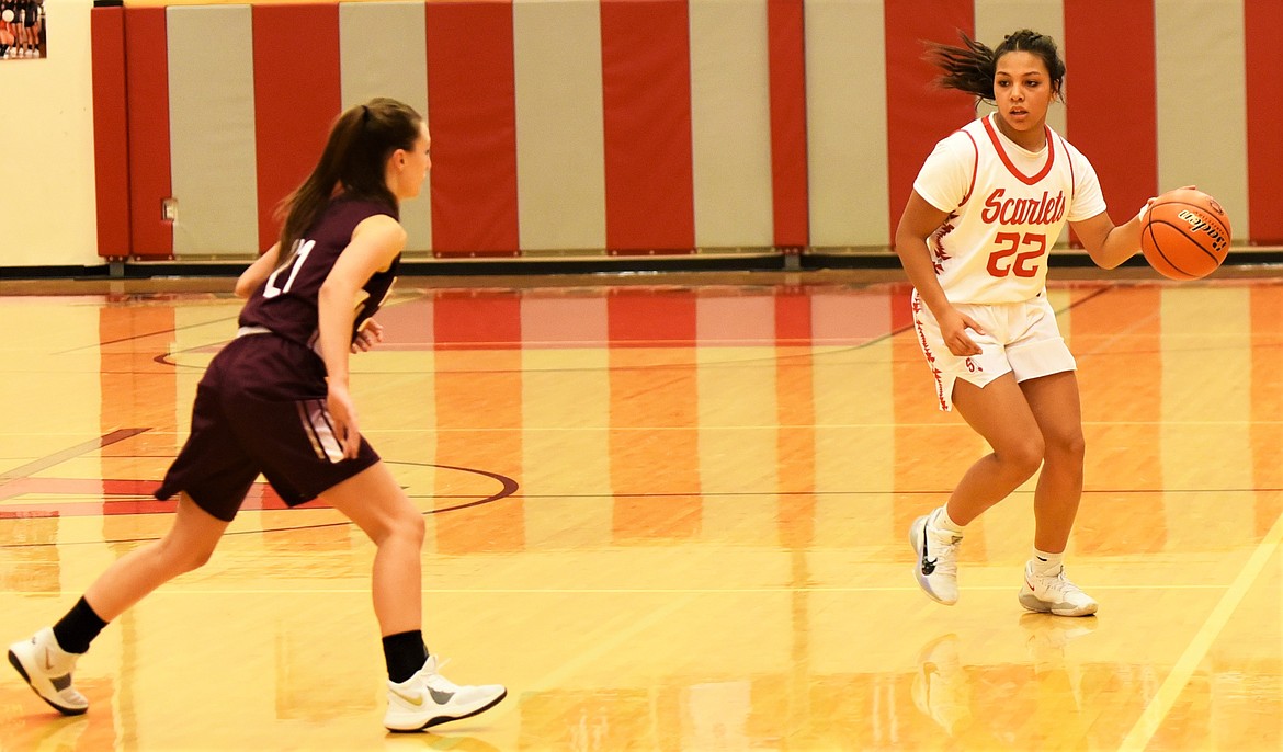 Arlee guard Princess Bolen dribbles up the court as Florence defender Olivia Coulter closes in. (Scot Heisel/Lake County Leader)