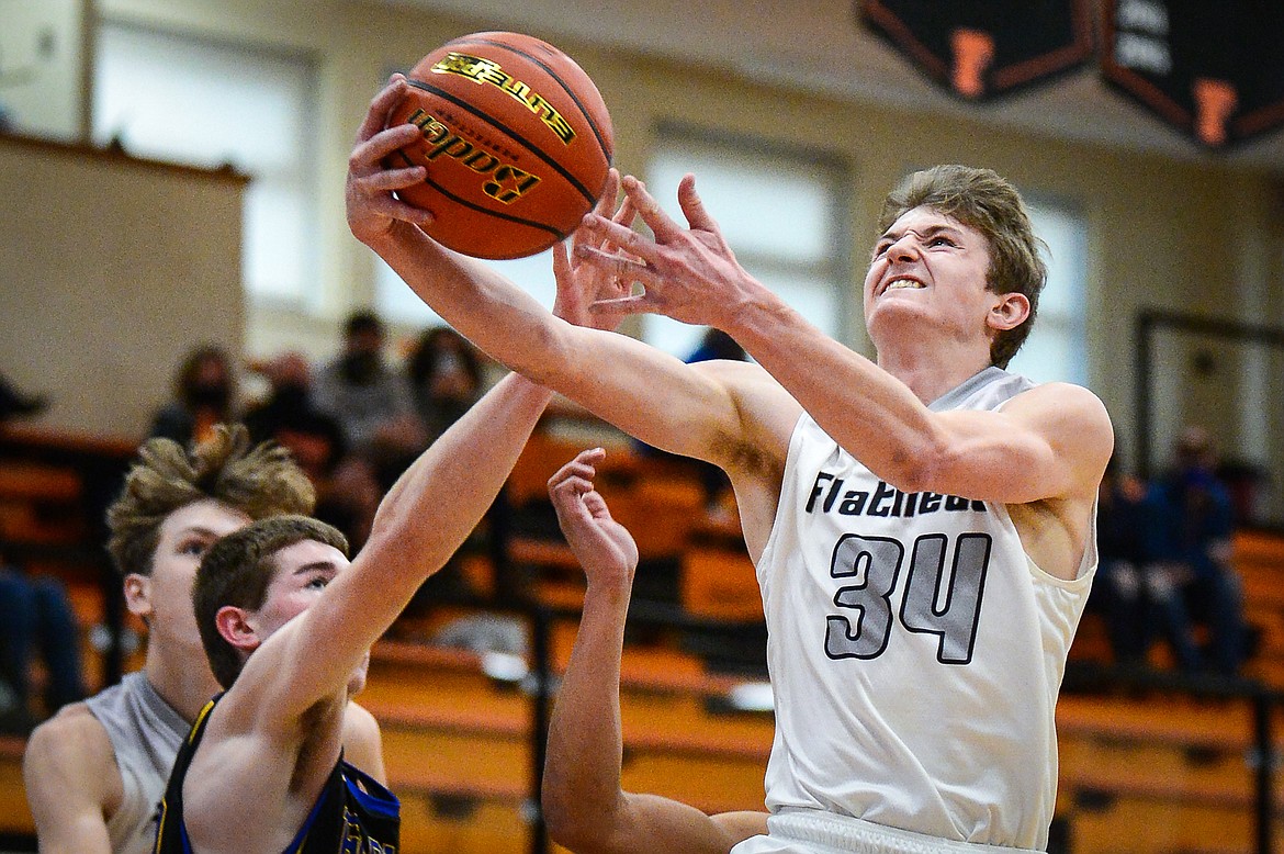 Flathead's Joston Cripe (34) heads to the hoop in the first half against Missoula Big Sky at Flathead High School on Saturday. (Casey Kreider/Daily Inter Lake)