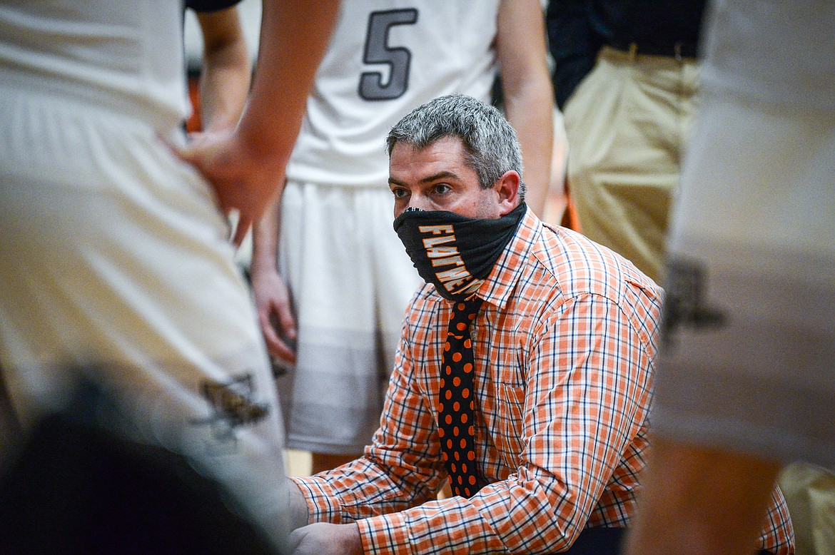 Flathead Braves head coach Dirk Johnsrud talks to his team during a timeout in the third quarter against Missoula Big Sky at Flathead High School on Saturday. (Casey Kreider/Daily Inter Lake)