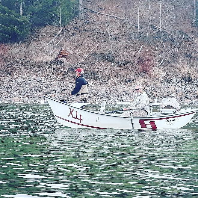 Layne Hansen, of St. Regis, fishes aboard his X Bar 4 drift boat on a winter day with David Griggs as his guide. Fishing on the Clark Fork in the winter can still bring ample opportunities to catch trout while also offering a quiet solitude on the river. (Photo courtesy Brooks Sanford)