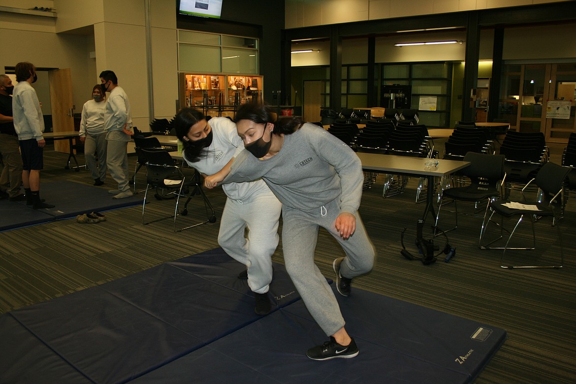 Gloria Barajas (right) and Valerie Raygoza (left), students in the criminal justice program at the Columbia Basin Technical Skills Center in Moses Lake, practice self-defense techniques.
