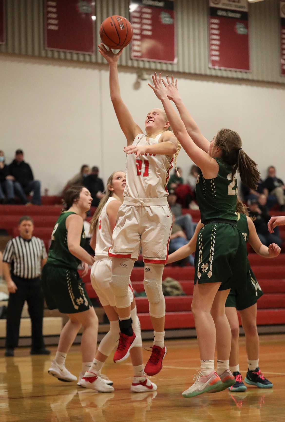 Sandpoint senior Hattie Larson fights through the St. Maries defense to attempt a layup on Jan. 2 at Les Rogers Court.
