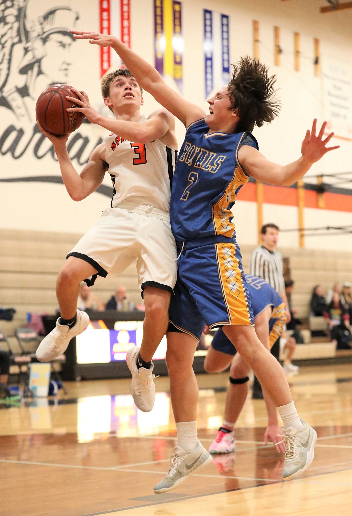 Priest River junior Jordan Nortz attempts to hit a contested shot over a North Idaho Christian defender on Monday, Jan. 4 at PRLHS.