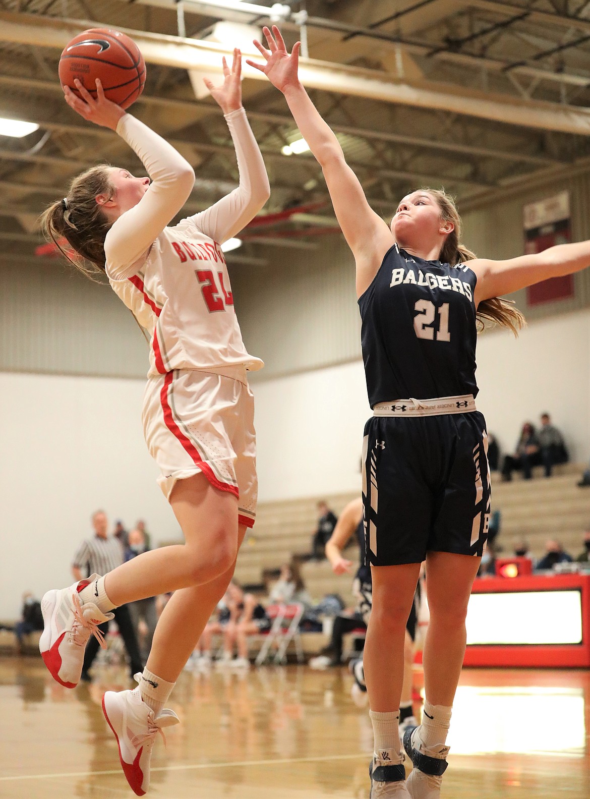 Sandpoint senior Kaylee Banks drives to the basket and attempts a shot over a Bonners Ferry defender on Jan. 5 at Les Rogers Court.