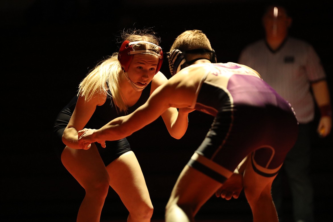 Sandpoint senior KJ Johansen (left) looks to make a move against Kellogg's Jaeger Hall during a 126-pound bout last Wednesday at Les Rogers Court.