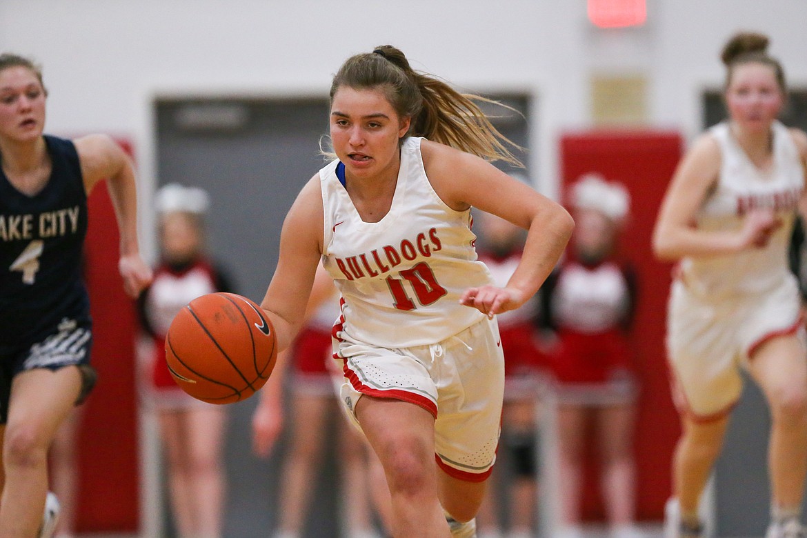 Junior Destiny Lyons dribbles the ball up the court during the second half of Tuesday's game.