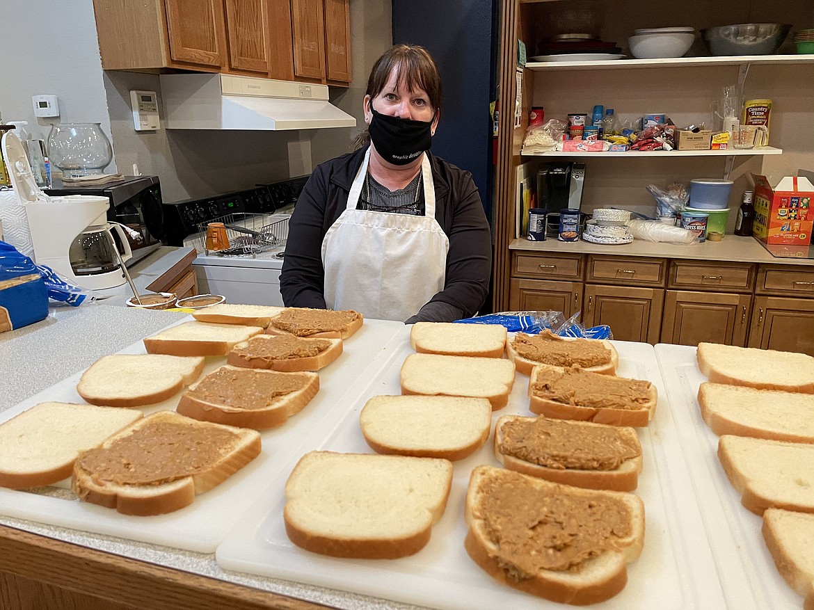Michelle Boetger as she prepares to make more sandwiches at Youth Dynamics in downtown Moses Lake on Tuesday.