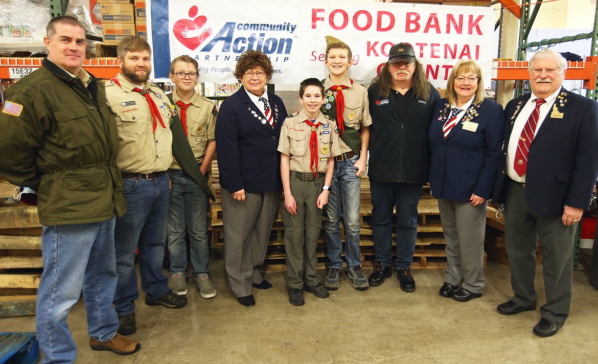 Coeur d'Alene Elks Lodge 1254 and Boy Scout Troop 202 donate to the Community Action Partnership on Tuesday. From left, Bruce Dubke, with Troop 202, Jason Charland, Troop 202 scoutmaster, Zane Laker, Karen Magner, past Exalted Ruler, Logan Fisher, Lash Laker, Darrell Rickard, CAP program manager, Debbie Nadrchal, Exalted Ruler, and Bob Shaw, vice president North Idaho State Elks Association.