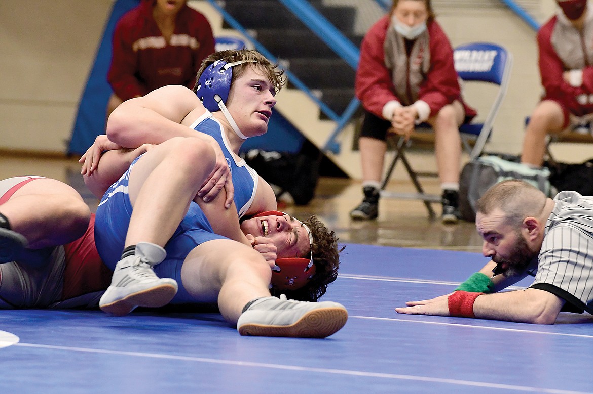 Wildcat sophomore Brandon Role pins Hamilton's Derrick Saltzman during a double-dual in Columbia Falls Tuesday evening. (Teresa Byrd/Hungry Horse News)