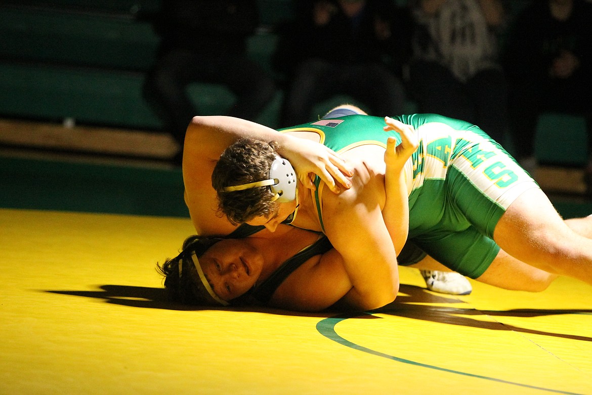 JASON ELLIOTT/Press
Lakeland's Sam Feusier puts Lake City's Logan Parson on his back during the 285-pound match on Wednesday at Lakeland High.
