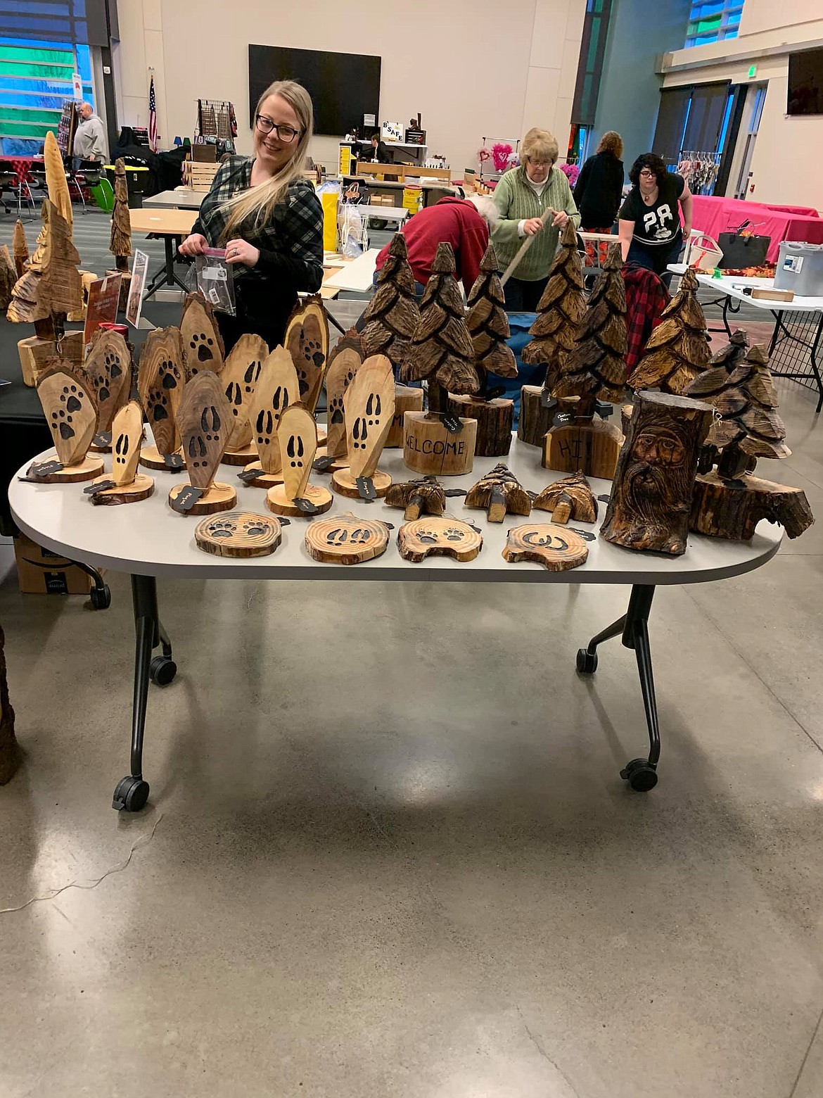 A table filled with works from Broken Branch Carvings sit on display at the Cupid's Market at CB Tech last February.