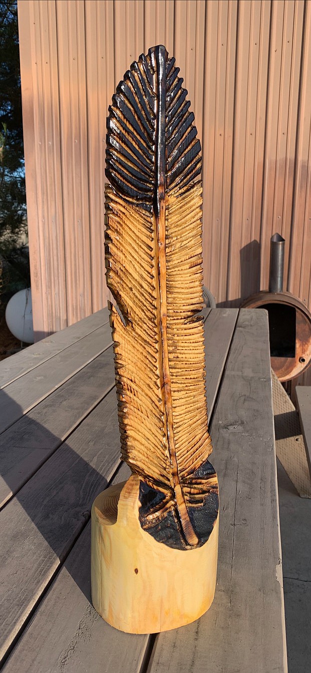 A feather carved out of wood by Cole Liebrecht, owner and carver at Broken Branch Carvings based in Ephrata.