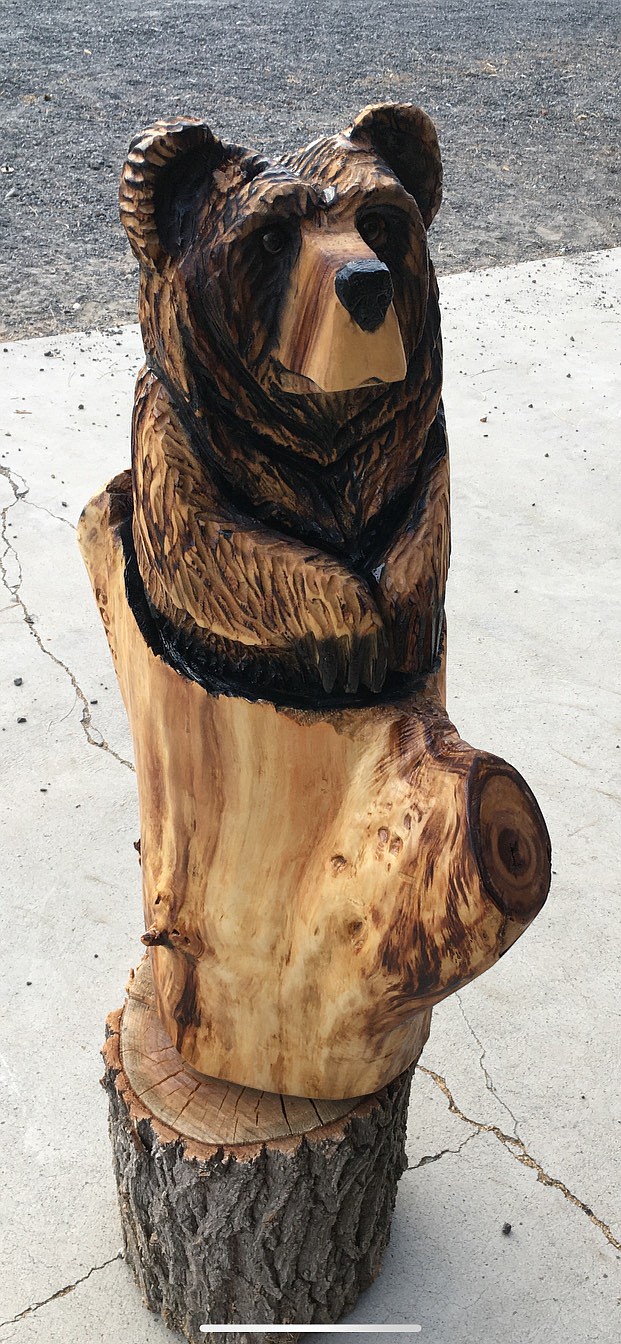 A bear carving made by Cole Liebrecht of Broken Branch Carvings.