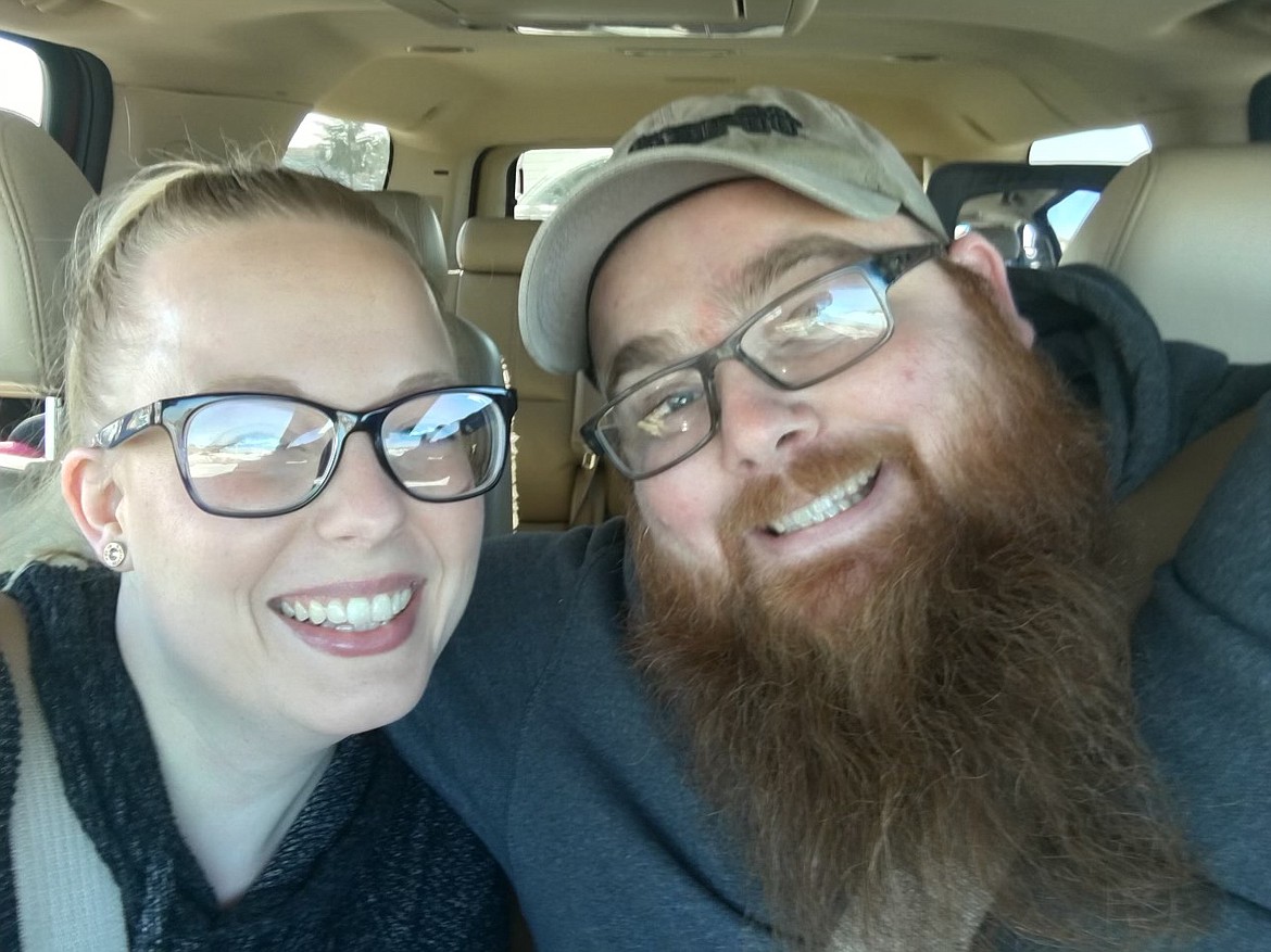 Cole Liebrecht and his wife Alexandrea Liebrecht smile for a photo together.