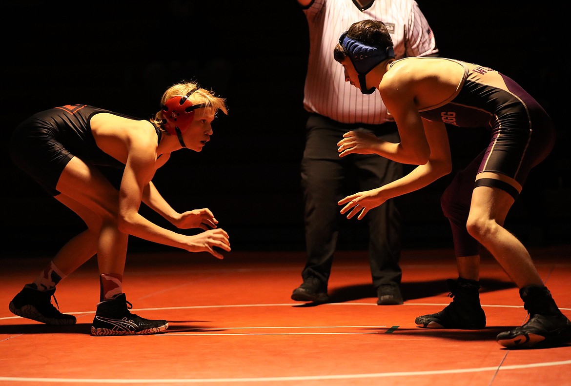 Sandpoint sophomore Forrest Ambridge (left) battles Kellogg's Dakota Eixenberger in a 113-pound bout on Jan. 6 at Les Rogers Court.