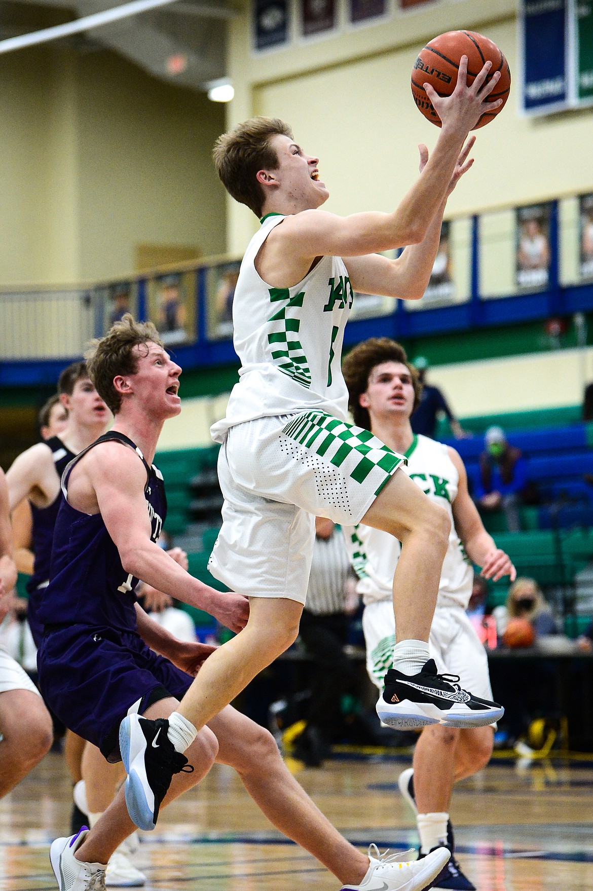 Glacier's Connor Sullivan (5) drives to the basket against Butte in the second quarter at Glacier High School on Thursday. (Casey Kreider/Daily Inter Lake)