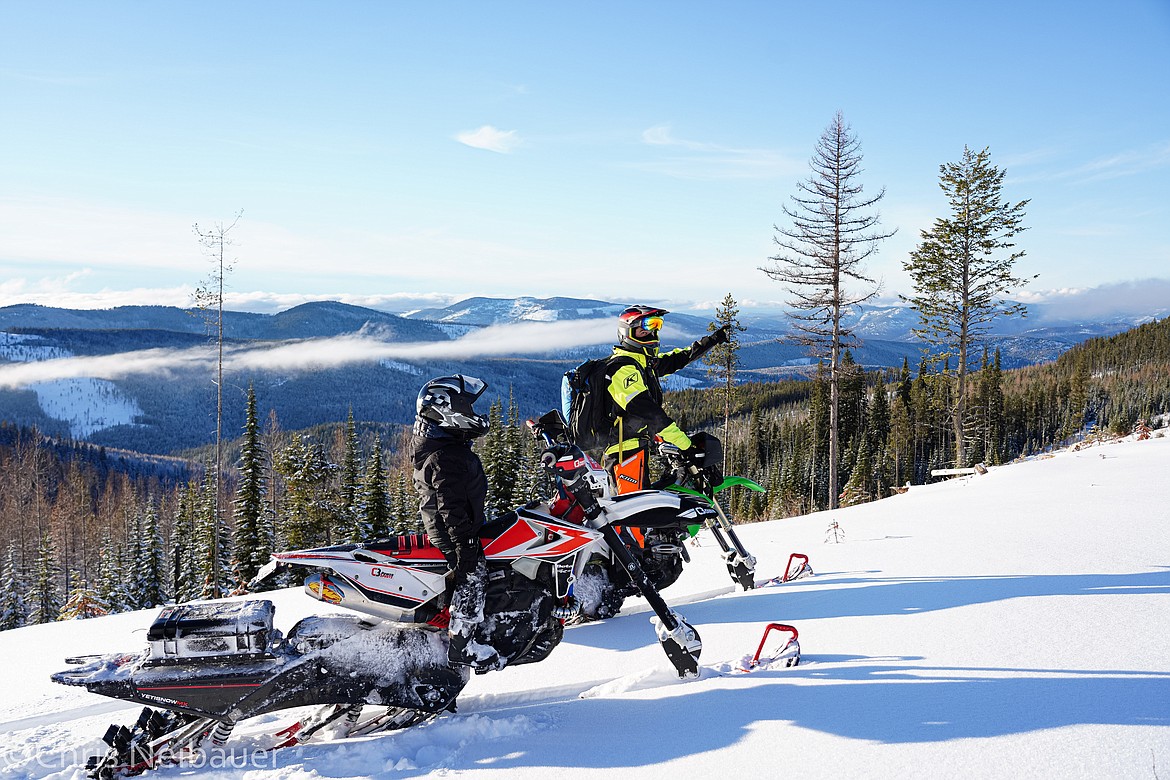 Kyle Allred pauses to look out over the valley on a backcountry snow bike ride.