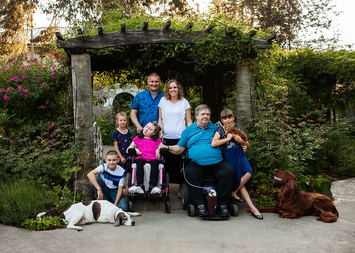The Rachels family, pictured a few years ago. From left to right, on bottom row: David, Annalee, Natalie, grandfather Arnold Cox, Makala. Above: Patrick and Jessica Rachels.