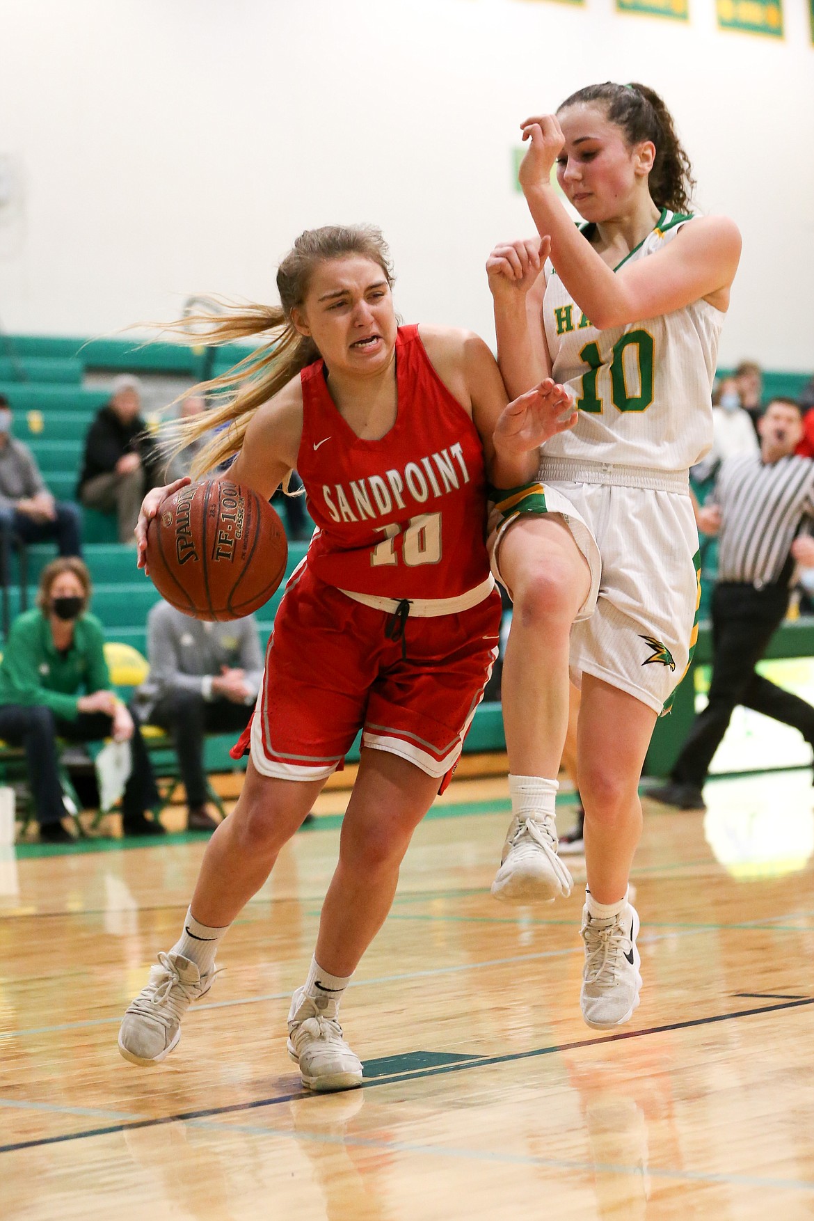 Junior guard Destiny Lyons fights off a Lakeland defender and drives toward the basket on Friday.