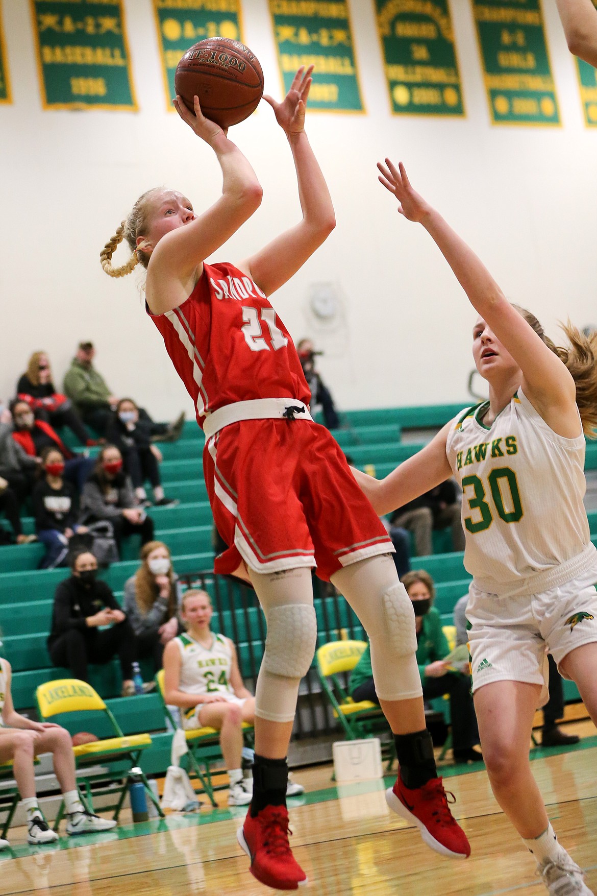 Senior Hattie Larson pulls up for a floater over a Lakeland defender on Friday.