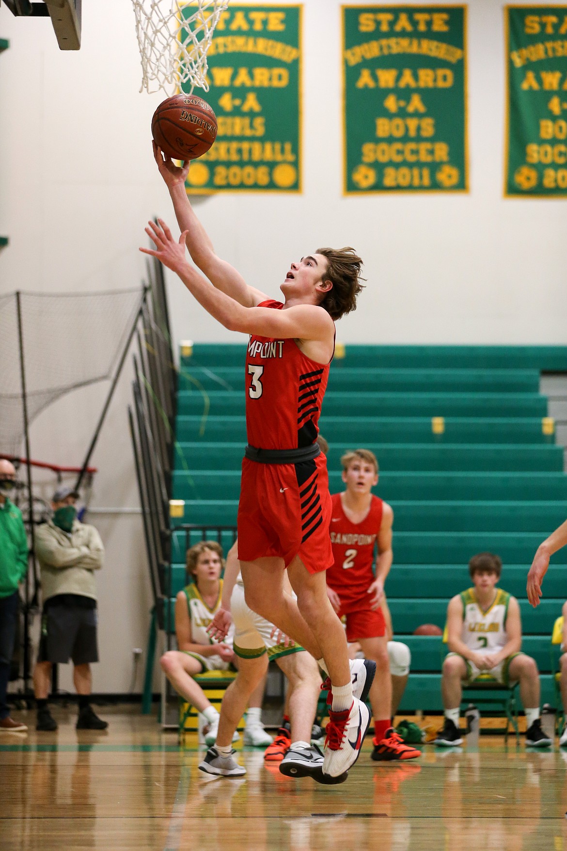 Freshman Max Frank drives to the basket and attempts a layup on Friday.