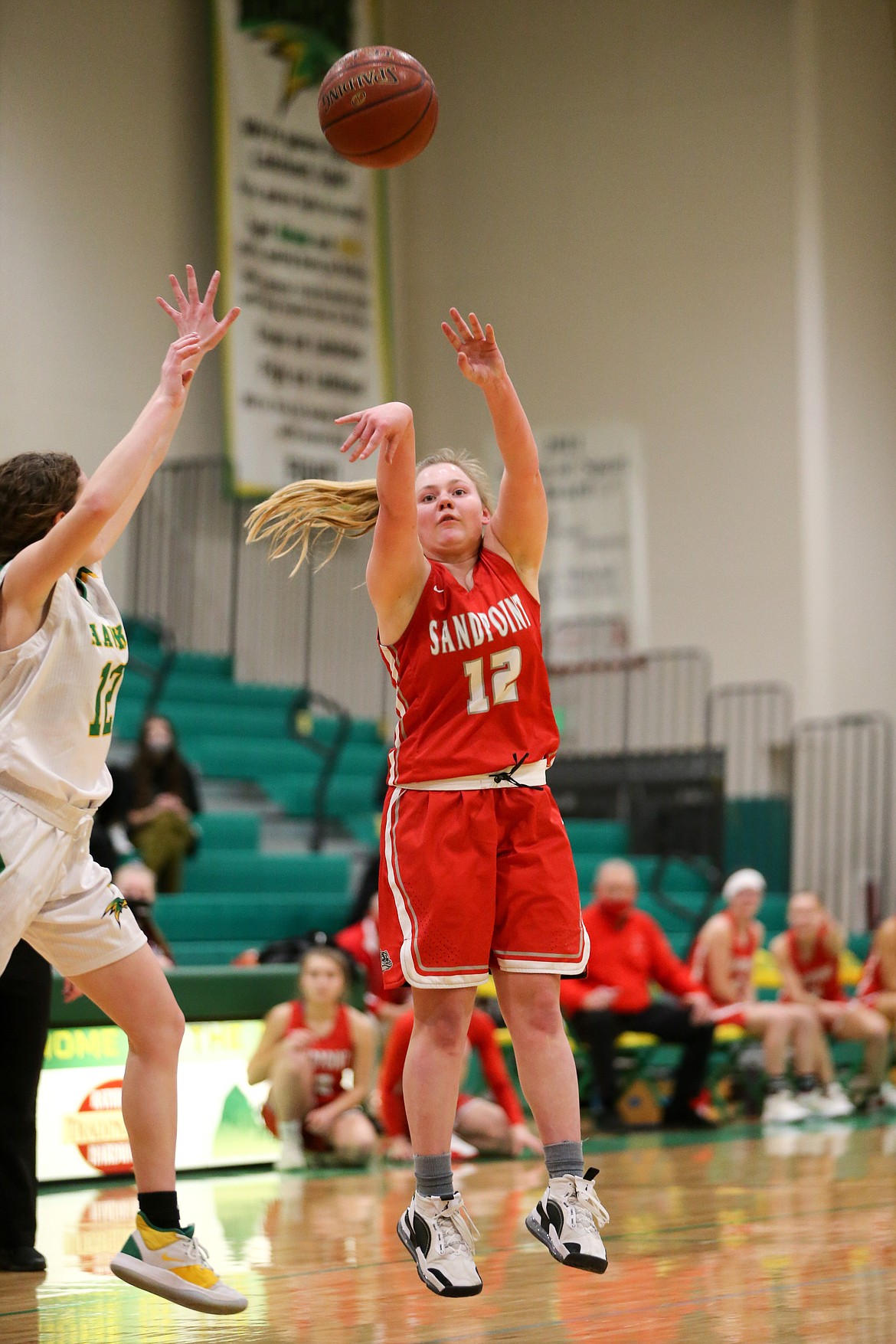 Senior Riley Cessna pulls up for a 3-pointer on Friday.