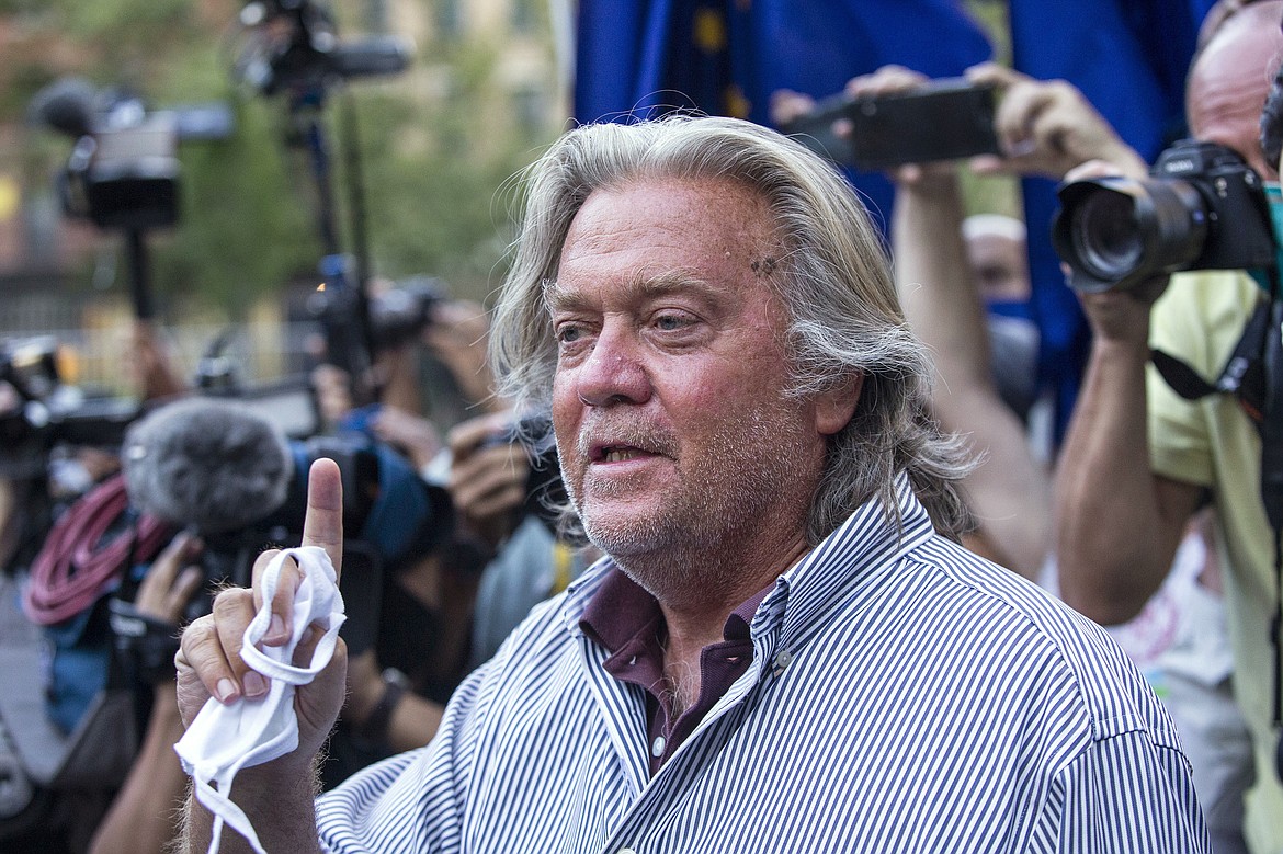 In this Aug. 20, 2020, file photo, President Donald Trump's former chief strategist, Steve Bannon, speaks with reporters in New York after pleading not guilty to charges that he ripped off donors to an online fundraising scheme to build a southern border wall. William A. Burck, a prominent Washington lawyer defending Bannon against the charges, notified a judge on Wednesday, Nov. 25, 2020, that he will no longer be representing Bannon in the case.