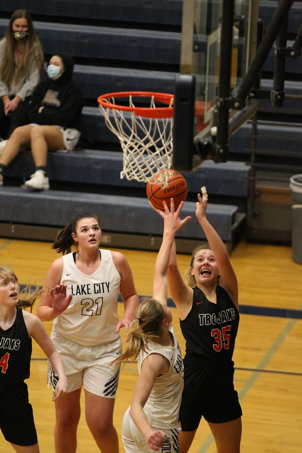 MARK NELKE/Press
Maya Blake (35) of Post Falls shoots over Hailey Jo Parks of Lake City on Friday night at Lake City.