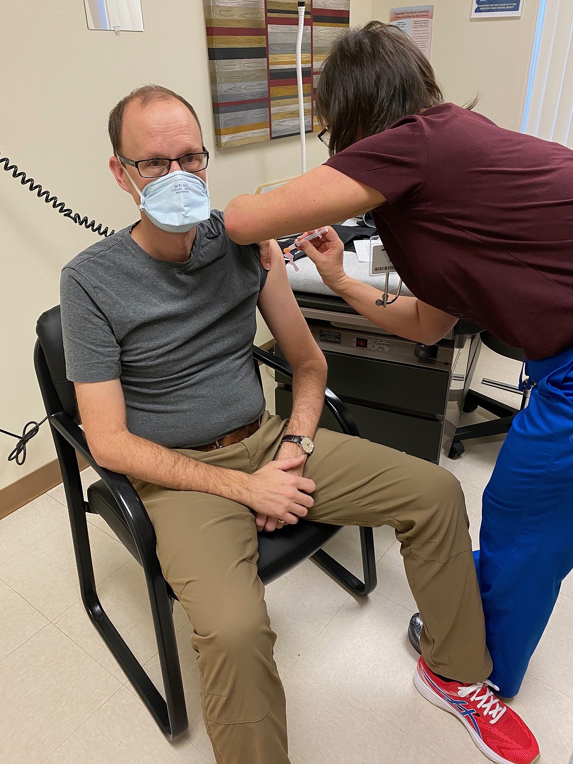 A Clark Fork Valley Hospital nurse gives physician’s assistant Nick Lawyer an initial dose of the coronavirus vaccine. (Clark Fork Hospital photo)