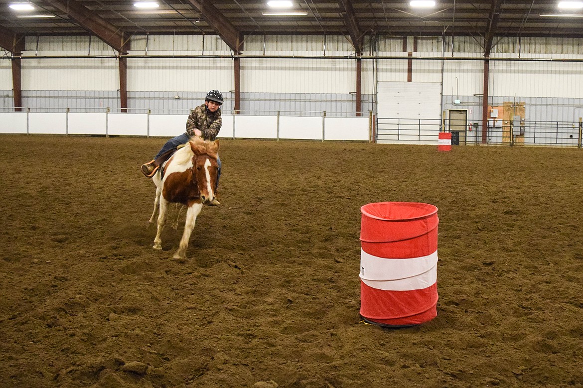 Carter of Moses Lake rounds a barrel at the Grant County Fairgrounds.