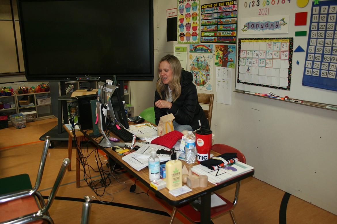 Columbia Ridge Elementary kindergarten teacher Jody Clark talks with her students during an online session Friday. Kindergarten classes are being housed in the gym while the school is undergoing remodeling.